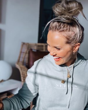 Emilie Ullerup Instagram - I bet we all have a moment in life that we can look back on and say “if it hadn’t been for _______ [insert friend, partner, parent, or even the way your country offers help if you’re in need), my life could look very different today”. That is the sentiment two wonderful creatives @leahyarddesigns and @unimpressedscreenprinting are reminding us of with their small-batch apparel collection called “SERIES - We are a series of events away from someone else’s life”. They’ve come together to create cool pieces and they’re donating 15% of each item sold to the @dewcvancouver Downtown Eastside Women’s Center … We can all find more empathy in our hearts these days. Support artists supporting great causes. 
I love my cropped hoodie 🤍 🤍 🤍 📸: @kylecassie