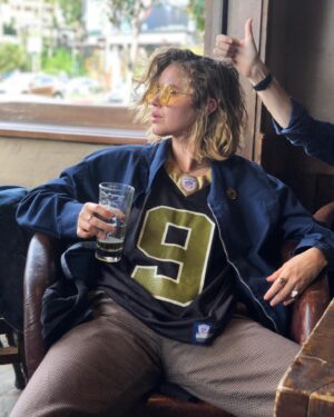 Emily Althaus Instagram - Me and the fellas like to throw back a beer, chat about our feelings, rub shoulders, and laugh at the things our ‘almost kids’ say. “Football” is just the excuse we use to have this time together. “Get your fellowship on by hook or by crook” - Steve says that. “You bring the cheese sticks, I’ll bring my uncertainty in (step)fatherhood” - I say that. #stepdads #saints #cheesesticks 📸: @martinspanjers