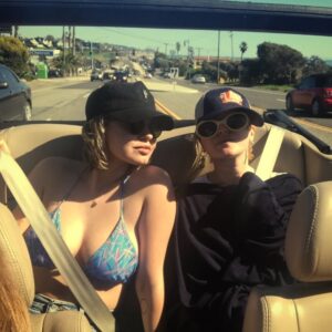 Emily Althaus Instagram - @elizabethkott said that if I took my shirt off I might be able to trick the sun into focusing it’s rage on my weathered bodied and away from her porcelain one. Full disclosure, I’d do damn near anything she asked. #tb #pch #thesehatschoseus ☀️📸: @ssimbari 🚗: @chelsannat