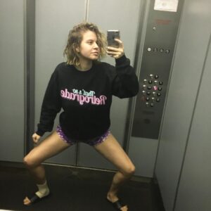 Emily Althaus Instagram - Special thanks to the hair and makeup team that created this strong look, who for some reason have requested to remain anonymous. It takes a village!  Also, @soretrograde is something you should really be looking into. *That’s a note for everyone. ADDING SOME HASHTAGS FOR THE KIDZ #soretrograde #squats #anklebracelet #thosethighs #elevator #cooldad