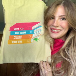 Emily Henry Instagram - Something very fun to announce today!  @outofprint made this very, very cute book tote which is available TODAY, but ALSO, to celebrate the launch they’re running a giveaway from now until September 12th from which you can win this ridiculously cute gift box filled with fun goodies and your next perfect beach read, @jasminepics’s Drunk On Love!! I’ll drop the link in my bio in a min, so check it out!