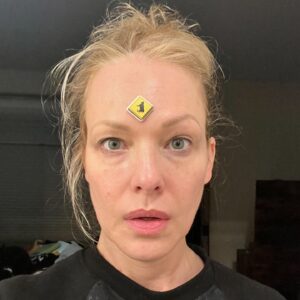 Erin Cummings Instagram - I walked downstairs last night after both kids were put to bed, in a house where everyone is sick with something (Covid, pinkeye, cooties, whatever) and realized that I had no idea when a sticker of a cow was put on my forehead. 

#twoundertwo