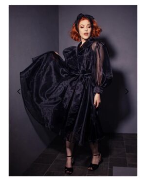Erin Cummings Instagram - We’ve been waiting for months to share these images and the wait is finally over! 

The EXCITING and GLORIOUS collaboration between @vixen_by_micheline_pitt, @la_femme_en_noir_ & BEETLEJUICE has just dropped on their pages.

I was thrilled when @michelinepitt asked me to embody the role of Delia, brilliantly portrayed in the movie by my idol, #CatherineOhara, for this shoot. 

I hope you have as much fun wearing these beautiful dresses and accessories as I did modeling them! 

#vixenbymichelinepitt #lafemmeennoir #beetlejuice