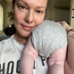 Erin Cummings Instagram - Our family of four is now complete… 👶🏻

Baby Girl Degnan arrived in early August. With the roar of a (Leo) lion and what looks to be a mane of her grandma’s red hair, she has a resting bitch face that could scare the arm hair off a grown man and a left cheek dimple when she smiles that could crash a thousand ships. I can’t wait to watch you bloom, my little magnolia.