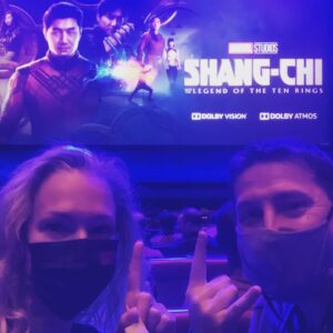 Erin Cummings Instagram - Sorry for the the bad lighting - I had to get this shot before the film begins. I am thrilled to be able to see @ShangChi for the first time, with @JohnCampea who is seeing it for the THIRD TIME! Thanks @cinemacon and thank you @disney for the screening!

UPDATE: I just saw Shang-Chi and it was INCREDIBLE. This is your can’t-miss, must-see-in-a-theater film of 2021! The story, cinematography, costumes, fight scenes, visual effects, and brilliant performances are the epitome of legendary filmmaking. Don’t walk, RUN to theaters when this opens on Sept 3. (But please make sure you’re also vaccinated and wear a mask for the sake of everyone around you). Shang-Chi!!!!