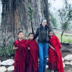 Eva Herzigová Instagram – Couldn’t resist this moment…there they were just standing in those striking deep red coloured robes that caught my eye first. Then I realised the majesty of the giant cypress tree they were playing in front of. It’s the oldest and perhaps the biggest tree in Bhutan.