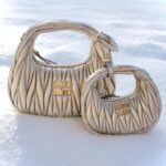 Ever Anderson Instagram - Thank you @miumiu gifting me the gorgeous Wander Bag along with the mini baby version!! Miu Miu x the great outdoors ❄️ #miumiu #miumiuholiday #ad #chrisbrennerphoto