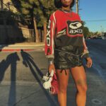 Freddie Ransome Instagram - My look for TEMPO last weekend🏁 Top: @thegoldlist.co Custom Skrrt: @thegoldlist.co Heels: @aliasmae Sunglasses: somewhere in Miami Jewelry: @gossamerjewels Bag: @brandonblackwoodnyc Sneakers (for when my feet got tired of being hot girls): Jordan 4s (Oreo)
