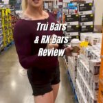 Gabbi Tuft Instagram – Part 2 – Come with me to Costco to look at protein bars.
–
I’m always looking for protein bars that actually have a decent amount of protein in them. Many dieticians lean towards what is called the 10x rule for protein.
–
If you take the total amount of protein in a food and multiply it by 10, it should then be equal to or greater than the total calories in that food. This would qualify that food (or protein bar) as a high protein food.
–
With the Tru Bars though, there wasn’t a lot of protein, a pretty large amount of added sugar, and sunflower oil. Seed oils are high in linoleum acid (Omega-6) and higher amounts throws off our omega 3 : omega 6 ratio. The linoleum acid also breaks down to arachidonic acid which triggers our endocannabinoid receptors – triggering hunger cravings.
–
The RX bars however, were all natural with no added sugars. They could definitely use more protein BUT they aren’t marketed as a protein bar. So I would add a secondary protein source here (hard boiled egg, side of meat, etc.).
–
1 more win for the Costco trip!
–
Over 2000 clients of success in the last 14 years.
–
Details in my profile for my one on one fitness and nutrition coaching
–
Or go to coachgabbi.com.
–
Happy shopping!
–
Not a paid partnership…with anyone – ever.
–
#healthy #healthyfood #nutrition
