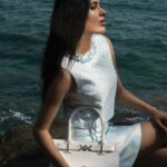 Geethika Tiwary Instagram - Geethika (@geethikaofficial) graces the rugged seaside, effortlessly merging timeless elegance with a contemporary edge. With her serene glow and undeniable confidence, she captivates the lens, creating a striking visual narrative. Tune in as we craft this coastal masterpiece, blending fashion, art, and nature in perfect harmony. —--------------------------------------------------------------- On @geethikaofficial: Look 1 Wool-blend fedora hat, Headscarf, Short wool crepe dress with satin details, Thigh-high flat boots, all by @dolcegabbana Look 2 Checkerboard-print beaded crop top, Check pattern mini-skirt, Medusa ‘95 tote bag, all by @versace. Earrings by @ellieador Look 3 Silk-blend Bandeau cropped top, Medusa ‘95 mini skirt in wool, Medusa over-the-knee boots, all by @versace Look 4 Fringed open-knit top and Fringed scalloped mini-skirt, both by @tomford, Ring and earrings, both by @ellieador —--------------------------------------------------------------- Talent: Geethika (@geethikaofficial) Photographer: Abdulla Elmaz (@abdullaelmaz) Stylist: Hussy ElCeliemy (@elceliemy) Creative Director: Talal Kahl (@talalkahl) Makeup artist: Jefferson Rivera (@jhajhamakeupartist) —--------------------------------------------------------------- #Geethika #Fashion #Actor #PartnerFeature