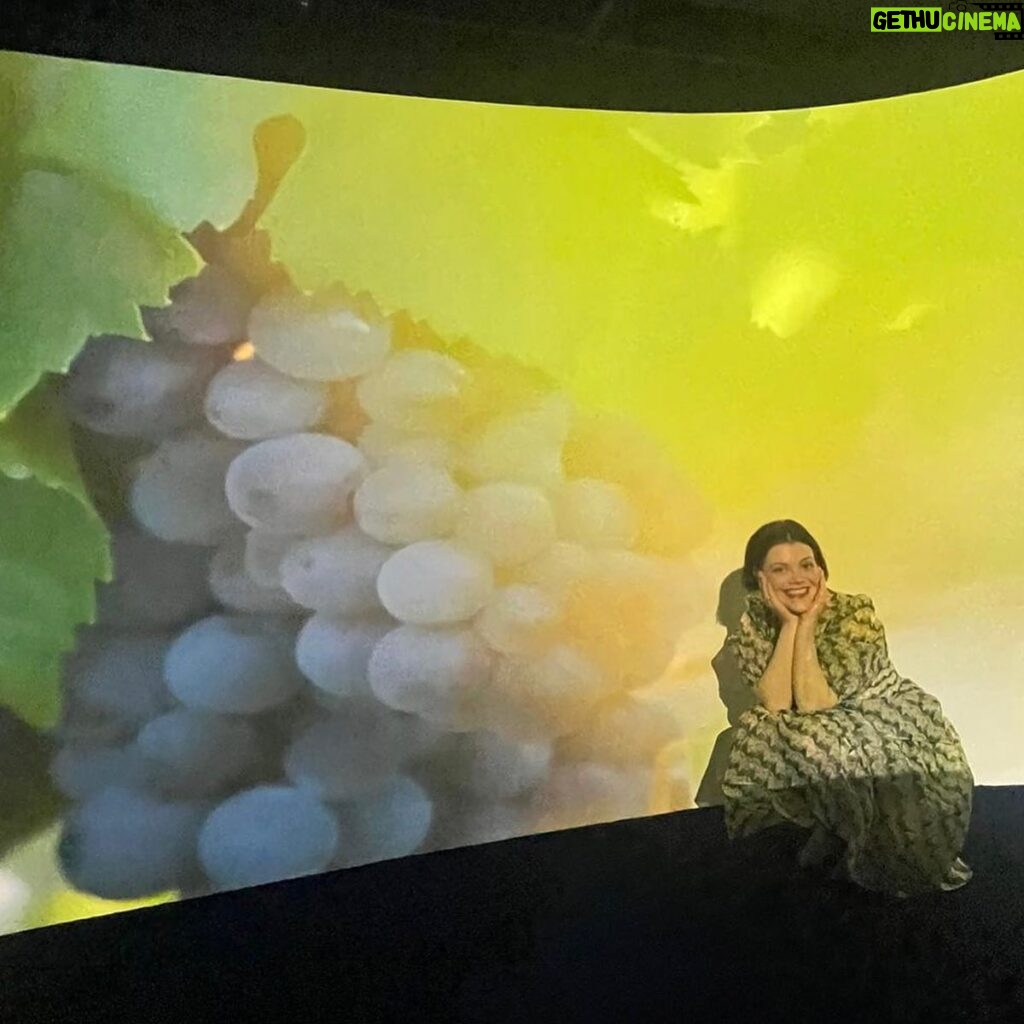 Georgie Henley Instagram - a very happy grape! completely joyous to celebrate female entrepreneurship and creativity with @veuveclicquot at their stunning exhibition Solaire Culture, bringing some much needed sunshine to London until the 6th June 🍇☀️🥂