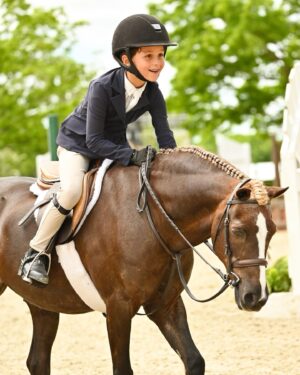 Georgina Bloomberg Instagram - The face of a boy who set a goal to work hard and ride his best all weekend, and was rewarded for doing just that with his all time high score of 91. 💪🏼💙🥇🐴 (📷: @selphoto327) @oldsalemfarmny @mwg330 @poniesandpalmsshowstablesllc