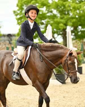 Georgina Bloomberg Instagram - The face of a boy who set a goal to work hard and ride his best all weekend, and was rewarded for doing just that with his all time high score of 91. 💪🏼💙🥇🐴 (📷: @selphoto327) @oldsalemfarmny @mwg330 @poniesandpalmsshowstablesllc
