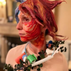 Georgina Bloomberg Instagram - Half underwater, and half on fire, draped in items to represent the many ways I am slowly dying, and topped off with a necklace  made from rope and plastic we picked up from the beach this summer, my version of Mother Earth was an angry one this Halloween. And because there are very few things scarier… I brought my terrifying sidekick Global Warming along for the night. 🌍🔥☠️🌊