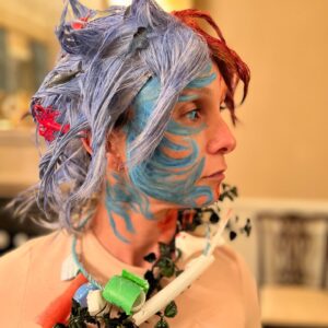 Georgina Bloomberg Instagram - Half underwater, and half on fire, draped in items to represent the many ways I am slowly dying, and topped off with a necklace  made from rope and plastic we picked up from the beach this summer, my version of Mother Earth was an angry one this Halloween. And because there are very few things scarier… I brought my terrifying sidekick Global Warming along for the night. 🌍🔥☠️🌊