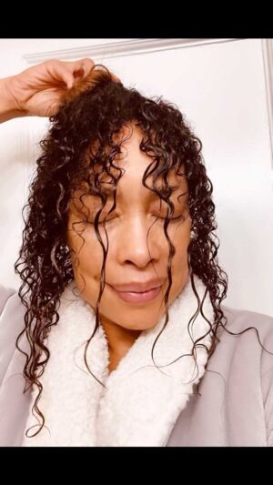 Gina Torres Instagram - Sharing a little self care moment…. Some of the amazing styles that @1nicnac creates for me on @911lonestar require a lot of smoothing and controlling products. You big hair & curly girls know it’s not about washing it out and styling everyday…. So midweek ~ to avoid too much buildup, I keep my crown protected and just give the perimeter some extra love and conditioning. Have you ever done this?? What’s your go to for hair care? Let’s share some tips!