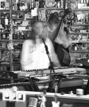 Hania Rani Instagram - I am so happy to share with you our performance from the legendary "Tiny Desk" at @nprmusic in Washington.

It was filmed on one of the last days of November 23', during my tour in North America. We arrived the day before, unfortunately both me and @ziemowitklimek were sick and feeling unwell after the first intense week in the States and a double show in NYC the day earlier. I felt almost woozy but thrilled on the other side and was really looking forward to the shooting day to come. I've already done a handful of challenging sessions in my life but this one seemed extreme. Firstly, I can hardly think of a more bizarre environment for an artistic performance - an open space office with its famous flamboyant corner, adorned with the oddest collection of clutter (which you are certainly dying to contribute to yourself). Secondly - the way you are going to perform - with no monitors, click, or in my case, vocal effects which feels completely terrifying at the first sight but on the other hand push you to rethink and reorchestrate your regular, dull setup. And lastly, the place and the people, the "Tiny" thing! The amount of anticipation and fear that is haunting you once your date with NPR is confirmed is enormous. And it is very understandable. So the moment when you finally arrive at the radio's parking slot and everyone is immediately taking care of you and simply behaving like the kindest and most fun people on Earth is an utter relief (and let's be frank - shock). The self doubt and stress is still in the air but the profound joy of making together something that might actually sound unique blurs the spiky edges and breaks the ice. 

To be very honest I don't remember much from this day. I was too giddy and too sick. But when I watched the video last Monday in the studio with my friend we were both similarly excited and happy. It feels simply unreal to me to see myself and Ziemo jamming there around, acting totally relaxed and focused. And arguably having a lot of genuine fun making music together. 

@nprmusic, @bob_boilen, the amazing "Tiny Desk" team and everyone else involved - thank you!