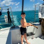 Hannah Goldy Instagram - Such a beautiful experience for Odin and I 🌊🐠🩷 Thank you @sailgetaways for adding another amazing core memory to our scrap book! …. The last pic is hilarious. I made him wake up to watch the sunrise with me 😂