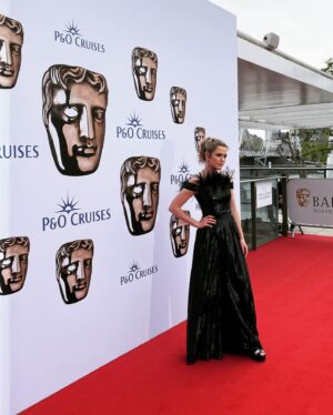 Harriet Dyer Instagram - That time we went to the BAFTAS to present an award and I didn’t open an envelope properly (see previous post). 
Classic Slap Dash Dyer. 
Thanks to Patty for making lemonade up there and holding my sweaty, rubbery hands.
Thanks to @todiscon for making it allll happen and the good people at @paramountgcd and @cbstvstudios for getting us over there. 
The love for Colin over in the UK has been epic and we are grateful to everybody who has watched it. 
Styling : @pennylovellstylist 
Outfit : @houghtonnyc 
HMU / full blown wizardry with my tired-ass, wrangling toddler on a long haul face : @carlafrancesca.mua 
Hair colour and psychologist: @leikerhair 

Slide 1 PA Images / Alamy Stock Photo
Slide 2 Scott Garfitt/ BAFTA via @gettyimages 
Slide 4 photograph by Joe Maher for @gettyimages 

Thanks to the @baftas for having us and @pandocruises for hosting a brilliant evening. 
Probably MOST importantly if anybody is still here, it wasn’t a dress, it was PANTS. 
Thank you for your time.