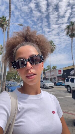 Hayley Law Instagram - Have you listened to COOL yet 😍? Painting Los Angeles with these stickers. Lemme know if you find one!!! COOL IS AVAILABLE ON ALL STREAMING PLATFORMS NOW. 

#newmusicfriday #popmusic