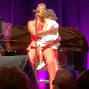 Heather Headley Instagram - A few weeks ago, I did a show at @atthemac, when I had a surprise, and incredibly cute visitor run out on stage to say hello to me. I traveled in that day for the show, and hadn’t seen much or enough of her. She asked her dad if she could come out and see me, and then proceeded to steal the show…and anything that was left of my heart. 
I asked her if she wanted to stay while I sang the next song which happened to be #WhenSheLovedMe (@randynewmanofficial, #ToyStory). It is now a moment that will stay sheltered in my mind and heart forever. A friend, who was there, snuck this picture and sent this to me, reminding me how much I love and miss her and our sons, and their amazing daddy…and just how blessed I am to be theirs.
 #mommydays #happysunday