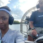 Heather Headley Instagram - We took a quick family trip, and my husband thought it would be fun (and somewhat romantic…) to visit the #everglades. It WAS fun! I loved it! However, as I got settled in, and started our trip into the marsh, our guide’s first words were… ‘Now, if a snake falls into this boat, don’t jump out! Throw it out. Take a selfie with it. Hand it to me. Do whatever. But DON’T. JUMP. OUT!!!’ 😳! I looked at him and thought, You must be crazy (as his shirt may suggest…), If a snake falls in this boat, let’s see how fast I jump right out and walk on this water to get out of here… Until… … I saw what else was in the water with us! 😐 I guess…my choice would be the selfie. #saycheese #alligator vs #snake #besttime #best #captain #dontcare #havemercy #happysunday