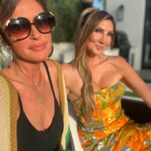 Heather McDonald Instagram - Slide Right. I Had a 1970 themed Palm Springs party last night. I got this dress b/c I knew it would pair perfectly with my sister’s.  Shannon is wearing our mom’s dress from the early 1970s. How cute is my daughter in @trinaturk More pics and videos to come. No filter or photo shop on these FYI @goldstein.shannon @kraftmackncheese @deniseaustin @thebrandyhoward #palmsprings #laquinta #party #cocktails #pool #palmtrees #memorialday #1970s #eveningdress #juicyscoop #heathermcdonald @shophelsi is my dress