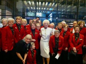 Holland Taylor Instagram - The Kennedy Center Ushers for the Eisenhower Theatre, specifically the Thursday night gang, were a wonderful group who responded so incredibly to ANN during our previews there, speaking their mind to my director Ben Klein, that I became determined to continue to hear from them.

The ushers generally had no access to the innards of the artist’s side of the theatre or the fabled Green room, which was a huge chandelier and couch filled haven where the great and garden variety folks came after the performance. I pled the case with KC management that, since I was the only performer, I felt they should allow the ushers to visit after the show along with other friends if I wanted that.  So, permission was granted, and for the first time, the “Redcoats,” as I called them, started appearing after the show — three one night, eight another — during the month ANN played there. Our last Saturday night happened to be my birthday, and the gang just floored me by arranging on their own for champagne and a birthday cake to celebrate, and ALL of them (a big group of about 30), it seemed, in attendance. I never will forget it. 

But nothing prepared me for the night on Broadway, more than a year later, when about 35 of them appeared IN THEIR Kennedy Center REDCOATS at a performance of “their” ANN at Lincoln Center. They had come up to NYC in a caravan of buses, trains, cars, and airplanes. They made an adventure of it and I consider it the greatest honor I’ve ever been given. They were rewarded, too, in a way — at the performance they attended were also President Bill Clinton and First Lady Hillary Clinton, Meryl Streep, Gabby Giffords, and Mark Kelly. Quite a night!