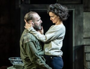 Indira Varma Instagram - Just released: brand new production shots of #RalphFiennes and @indiravarma in #MacbethTheShow. Now playing in Edinburgh until 27 January. London performances begin 10 February.
 
📸: @marcsbrenner
🎟️: macbeththeshow.com
 
Creative Team:  Simon Godwin - Director
Frankie Bradshaw - Set and Costume Design
Emily Burns - Adaptor
Jai Morjaria - Lighting Designer
Christopher Shutt - Sound Designer
Asaf Zohar - Composer
Sam Clarkson for Sound Quiet Time - Co-Sound System Designer Lucy Cullingford - Movement Director
Susanna Peretz - Hair, Makeup & Prosthetics Designer
Kate Waters - Fight Director
Amy Ball - Casting Director