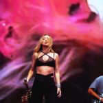 Ingrid Andress Instagram - baby’s first lolla did not disappoint!! thank y’all for coming out in the rain to see me 🫶🏻 top 5 artist bucket list moment for me 🥹 📷 @worldfamousmuriel