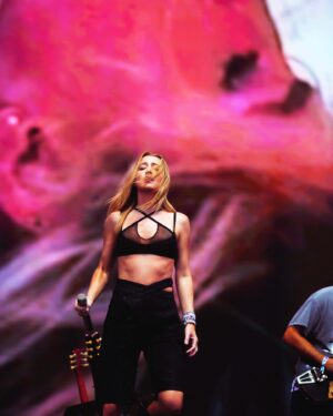 Ingrid Andress Instagram - baby’s first lolla did not disappoint!! thank y’all for coming out in the rain to see me 🫶🏻 top 5 artist bucket list moment for me 🥹

📷 @worldfamousmuriel