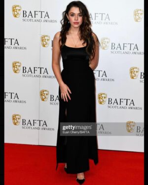 Isis Hainsworth Instagram - HI HI HI ooft thank you so so much @baftascotland for having me. I can’t believe I was lucky enough to not only be in that room with all those talented and lovely people but I actually got to hand an award to some of them. 

Styling- @bethfenton_ the BEST🖤
Dress- @raquette 
Shoes- @malonesouliers 
Jewellery- @beccajewellery 

(And thanks to my dad for being the best plus one I could ask for and wearing THAT HAT)

#bafta #baftascotawards