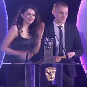 Isis Hainsworth Instagram - HI HI HI ooft thank you so so much @baftascotland for having me. I can’t believe I was lucky enough to not only be in that room with all those talented and lovely people but I actually got to hand an award to some of them. 

Styling- @bethfenton_ the BEST🖤
Dress- @raquette 
Shoes- @malonesouliers 
Jewellery- @beccajewellery 

(And thanks to my dad for being the best plus one I could ask for and wearing THAT HAT)

#bafta #baftascotawards