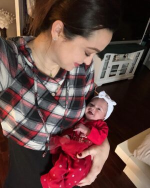Jaclyn Glenn Instagram - Christmas morning smiles from a 4 day old! 🥹 I know it’s just her learning how to move facial muscles at this point, but still so stinkin cute!!! 🥰