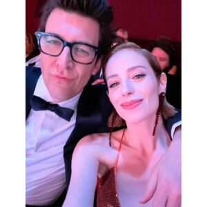 Jaime Ray Newman Instagram - Dreamy night at the Oscars with the hottest date on earth @guy_nattiv 🔥🧡💫

Thank you to THE GREATEST GLAM TEAM!

Stylist: @taraaquilinastyle 
Makeup: @beautyby_lana__ 
Hair: @michaelforrey 
Dress: @netaporter @galvanlondon 
Jewels & Purse: @alexisbittar 
Heels: @scarosso 
📸: @bucknerphoto 

Special shout out to THE BEST Grandma @madame_bob Auntie @bethnicolenewman and @robbygee212 who held down the fort while Ima & Aba had a much needed night out 🍑🧡