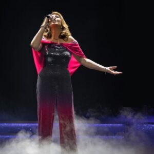 Jane McDonald Instagram - I loved this disco inspired jumpsuit! I bought in New York, it had a tequila sunrise vibe - and you know how I love a cocktail! I added a cape to cover my arms (which I’m conscious of). I absolutely loved performing in it!! 
(Photos from my 2019 Christmas show at @firstdirectarena in #leeds )