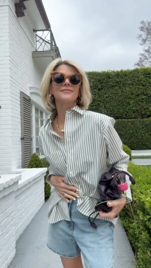 Janet Gunn Instagram - Looking for a sharp oversized shirt? The Borrowed Pocket Shirt in Gem Multi is a great cotton, poplin button-down. It’s the perfect oversized fit! @frame 
The Easy Short in Fizz Indigo - a high-rise short designed for every day wear, and it’s relaxed with an A-Line shape that elongates the leg. 
Shoes @madisonmaison Use code Janet15.
Pearl @chanluu Favorite Hoops @ylang23 
✨see stories for direct links✨
#casualchic #oversizedshirt #framejeans #madisonmuse #bocceball #womensoxfords