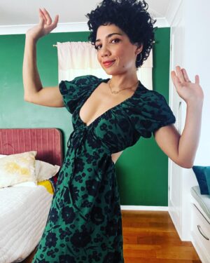 Jasika Nicole Instagram - This has been in heavy rotation this summer, which was an unexpected surprise. I thought it might be too dressed up to wear casually but I was wrong- it’s surprisingly comfortable and feels like a regular sundress, although it’s clearly anything but. I was inspired to make this after I saw @whatkatiewears and @ravelout ‘s versions. The pattern is the #oonadress by @vikisews, a Russian pattern company. The instructions were surprisingly great as I’ve found that a lot of translated instructions can be a bit sparse or lacking. But these came with good pics, detailed instructions and was easy to follow, which was important considering the unique construction. It came together pretty quickly by using facings to create tunnels for all the elastic and the drawstring. My only suggestion would be to keep as many of your elastic casings open on one end as possible til most of the dress is constructed, then try it on to make sure the elastic lengths are comfortable for you; I had to shorten my neck elastic by several inches in order for it to feel secure. Others who made this dress ended up having to stitch the center up a couple of inches so they wouldn’t feel too exposed which is a great fix, but my B cups are able to feel totally fine in such a low cut. Someone once told me they were “blessed by the booby gods” cause they were so well endowed, and it really changed my perspective on my own relationship with my body because I also think I was blessed by the booby gods, but for the opposite reason 😂despite what uber self conscious high school Jasika thought was desirable in the 90’s, it turns out that I adore my small boobs! They are so easy to manage! I could run for an hour without a bra and not hurt! I can go braless in a t shirt and no one will even notice. I can wear inexpensive bras and still feel supported! Moral of the story is, a true blessing is one that brings you peace, whatever that may look like. Sincerely,
Card Carrying Member of the Itty Bitty Titty Commitee 
Beautiful fabric is a green and dark blue rayon(?)) from @blackbirdfabrics ❤️
