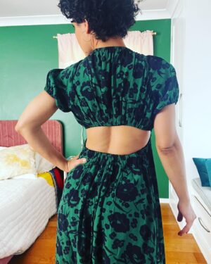 Jasika Nicole Instagram - This has been in heavy rotation this summer, which was an unexpected surprise. I thought it might be too dressed up to wear casually but I was wrong- it’s surprisingly comfortable and feels like a regular sundress, although it’s clearly anything but. I was inspired to make this after I saw @whatkatiewears and @ravelout ‘s versions. The pattern is the #oonadress by @vikisews, a Russian pattern company. The instructions were surprisingly great as I’ve found that a lot of translated instructions can be a bit sparse or lacking. But these came with good pics, detailed instructions and was easy to follow, which was important considering the unique construction. It came together pretty quickly by using facings to create tunnels for all the elastic and the drawstring. My only suggestion would be to keep as many of your elastic casings open on one end as possible til most of the dress is constructed, then try it on to make sure the elastic lengths are comfortable for you; I had to shorten my neck elastic by several inches in order for it to feel secure. Others who made this dress ended up having to stitch the center up a couple of inches so they wouldn’t feel too exposed which is a great fix, but my B cups are able to feel totally fine in such a low cut. Someone once told me they were “blessed by the booby gods” cause they were so well endowed, and it really changed my perspective on my own relationship with my body because I also think I was blessed by the booby gods, but for the opposite reason 😂despite what uber self conscious high school Jasika thought was desirable in the 90’s, it turns out that I adore my small boobs! They are so easy to manage! I could run for an hour without a bra and not hurt! I can go braless in a t shirt and no one will even notice. I can wear inexpensive bras and still feel supported! Moral of the story is, a true blessing is one that brings you peace, whatever that may look like. Sincerely,
Card Carrying Member of the Itty Bitty Titty Commitee 
Beautiful fabric is a green and dark blue rayon(?)) from @blackbirdfabrics ❤️