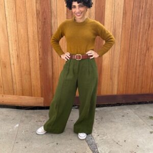 Jasika Nicole Instagram - These are the #proteapants by @paradisepatterns in Kolkata fabric from @stonemountainfabric and I am in absolute love! Wide pants haven’t been my jam since JNCOs quietly excused themself from my delia*s catalogues so I was surprised at how excited I was to make, wear and style these but *wow* they did not disappoint. Going up to a size 61” hip, these comes in two views, one with the deep pleat like what I’m wearing, and one without. I only made a couple adjustments to these- I changed the side seam pocket to a curved one because they lay on my body better, and I edge stitched the fold of my pleat on the front and back to make sure it stayed crispy and  clean looking. I’ve always been so fearful of wide pants without heels underneath them because I’m afraid they will swallow me up since I’m on the short side, and I’m so glad I was wrong- I can’t wait to pair them with sandals and other flats! All of Paradise patterns have been a real joy to make- she always includes some technical tidbit in the instructions that I’ve never heard of that I can then add to my sewing vocabulary and I LOVE how she included instructions to get a top stitched look or a clean look- I usually just automatically top stitch pants because I learned this with jeans making and just stuck with it but excluding top stitching gives you a slightly different look and it’s those details that I am always thrilled to see included in indie sewing patterns. I absolutely want a summery pair in maybe a yellow or pastel pink? Not sure yet, but I definitely have more pairs of these in my future. Sweater is knitted from a pattern designer I won’t name, belt is memade and shoes are RTW chucks ❤️! PS we got a new fence! No more diamond encrusted metal wire for us (IYKYK lol)! I can finally take pics outside on our own property that don’t look awful 🥹