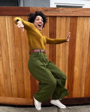 Jasika Nicole Instagram - These are the #proteapants by @paradisepatterns in Kolkata fabric from @stonemountainfabric and I am in absolute love! Wide pants haven’t been my jam since JNCOs quietly excused themself from my delia*s catalogues so I was surprised at how excited I was to make, wear and style these but *wow* they did not disappoint. Going up to a size 61” hip, these comes in two views, one with the deep pleat like what I’m wearing, and one without. I only made a couple adjustments to these- I changed the side seam pocket to a curved one because they lay on my body better, and I edge stitched the fold of my pleat on the front and back to make sure it stayed crispy and  clean looking. I’ve always been so fearful of wide pants without heels underneath them because I’m afraid they will swallow me up since I’m on the short side, and I’m so glad I was wrong- I can’t wait to pair them with sandals and other flats! All of Paradise patterns have been a real joy to make- she always includes some technical tidbit in the instructions that I’ve never heard of that I can then add to my sewing vocabulary and I LOVE how she included instructions to get a top stitched look or a clean look- I usually just automatically top stitch pants because I learned this with jeans making and just stuck with it but excluding top stitching gives you a slightly different look and it’s those details that I am always thrilled to see included in indie sewing patterns. I absolutely want a summery pair in maybe a yellow or pastel pink? Not sure yet, but I definitely have more pairs of these in my future. Sweater is knitted from a pattern designer I won’t name, belt is memade and shoes are RTW chucks ❤️! PS we got a new fence! No more diamond encrusted metal wire for us (IYKYK lol)! I can finally take pics outside on our own property that don’t look awful 🥹