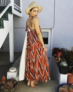 Jasika Nicole Instagram - The gorgeous marbled  #SmultronDress by @paradisepatterns that I made at the beginning of the year unfortunately suffered a mishap in the wash and got dyed green in some spots 😖 (pls, no advice on how to get stains out, thx). I’m sure I will wear it as a house dress once the sadness dissipates a little lol. But til then, I wanted to make another version that I could enjoy, untarnished. Since my first version was made with @corefabrics it seemed only fitting that my replacement version feature their fabric too. This viscose with zigzag print is just *chefs kiss*. Perfectly situated in my seasonal palette, it’s soft, it’s flowy (tried to capture it’s movement with the camera) and feels like a breezy silk. In a cruel twist of fate, I didn’t have enough fabric to make the extended length of the dress I wanted to, but instead of abandoning my plan I just amended it. I had a long cut of this off white dupioni silk in my stash and decided to sub it in for the back panel I was missing from my main fabric. It was risky mostly because the white silk is not quite as flowy as the viscose, but I was confident that it could be a design feature- a dress not only print and color blocked, but structure blocked too. It came out better than I thought it would- the change in fabric doesn’t bother me at all, and it’s still a really swishy, sexy dress to wear- it feels like it’s dancing around your body! I can’t wait to wear it at an event with my black high heel clogs! Big fan of this and the others from @paradisepatterns  and of course always loving the work that the @closetcorepatterns /@corefabrics team does, too 💕 summer hat by @byvladainsta 😍