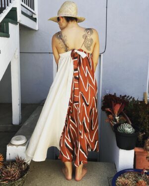 Jasika Nicole Instagram - The gorgeous marbled  #SmultronDress by @paradisepatterns that I made at the beginning of the year unfortunately suffered a mishap in the wash and got dyed green in some spots 😖 (pls, no advice on how to get stains out, thx). I’m sure I will wear it as a house dress once the sadness dissipates a little lol. But til then, I wanted to make another version that I could enjoy, untarnished. Since my first version was made with @corefabrics it seemed only fitting that my replacement version feature their fabric too. This viscose with zigzag print is just *chefs kiss*. Perfectly situated in my seasonal palette, it’s soft, it’s flowy (tried to capture it’s movement with the camera) and feels like a breezy silk. In a cruel twist of fate, I didn’t have enough fabric to make the extended length of the dress I wanted to, but instead of abandoning my plan I just amended it. I had a long cut of this off white dupioni silk in my stash and decided to sub it in for the back panel I was missing from my main fabric. It was risky mostly because the white silk is not quite as flowy as the viscose, but I was confident that it could be a design feature- a dress not only print and color blocked, but structure blocked too. It came out better than I thought it would- the change in fabric doesn’t bother me at all, and it’s still a really swishy, sexy dress to wear- it feels like it’s dancing around your body! I can’t wait to wear it at an event with my black high heel clogs! Big fan of this and the others from @paradisepatterns  and of course always loving the work that the @closetcorepatterns /@corefabrics team does, too 💕 summer hat by @byvladainsta 😍