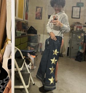 Jasika Nicole Instagram - I want to close out the year having documented my last couple months of making, which was inspired by finding my-my-my sewjo❤️ 
1. I finally decided to learn to read crochet patterns, and being a lifelong knitter, I’m glad I got over myself, as crochet has been scratching the itch that knitting has failed to accomplish the last couple years. I made this shawl mimosa by fiore in a couple weeks with yarn from @missceliespants that I only know as being an Italian wool and feeling like a silky cotton (as someone that’s sensitive to lots of wools that others seem to tolerate just fine, that’s saying a lot).
2. A crocheted doll for my new young friend Ruby ( pattern by @sweetsofties - she also has a little penis pattern that is so cute I might have to make some to give as gifts!) 
3. speaking of gifts I made the most Xmas gifts for others this year than perhaps ever and the joy and delight I got from it (even though I was stressed about finishing in time) was such a surprise to me. Maybe I’ve gotten better at making for others- Everything fit and everyone was happy! makes me excited to do it again maybe just start earlier than dec 1?!?!? 🙃
Peek-a-boo patterns kids button up in matching  African wax print for my nephews and… 
4. My dad! After he opened it he said it reminds him of a Nehru style shirt he loved that someone gave him when he was a kid 🥹 (Dan shirt by @efpattern )
5. Upstyled @quinnofeaglerock dream pants by partnering some bell bottoms on poshmark and with a little gold leather from my stash ⭐️ 
6. Used a gorgeous no-stitch leather pattern by @mprleatherworks to make some gifts out of leather in my stash- @lastassembly when are you dropping ur own 👀👀👀
7. I made this painters vest for my brother from sew what patterns on Etsy and was immediately obsessed with every detail. On him it’s fitted and looks great of course but when sized up with a cute little outfit underneath on me, it gives such a cool and relaxed aesthetic. I have already made plans to make one for myself in the same size 😮‍💨
8. The #mothwingcapelet by @minimalistmachinist is the project that got me out of my #NoSewJo slump in nov. It’s getting its own post soon 🧡