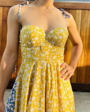 Jasika Nicole Instagram - My latest make for @wearethefabricstore in a floaty, lightweight liberty tana lawn that I colorblocked in yellow and blue. The dress is partly hacked and partly self drafted- the bodice took some time to get right (now that I’ve labored on this Frankensteined bustier I’m sure a bunch of pattern companies will come out with the perfect pattern that I have been searching for for months lol) but I’m happy with how it turned out and absolutely love the silhouette on me! Clogs are memade and omg after rolling my hair yesterday I realized that my hair is exactly the style I was hoping to get when I got my awful haircut last august! The growing out will continue cause I miss the versatility of longer hair but at least this is progress! More details on this make at jasika.com 💕