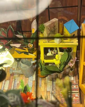 Jasika Nicole Instagram - My neighborhood besties @cyndiotteson and @quinnofeaglerock gifted me the cutest diy miniature room kit to put together last year, and I loved it so much I asked for a bigger kit for christmas, and at long last, only 9 months later 🥴, it’s finally done! This kit was like my personal equivalent of a 1,000 piece puzzle (though I’ve never done one so I don’t know how accurate that is). All I know is that it was extremely intense, required so much focus that I felt cross eyed at the end of some sessions, and required every bit of my concentration for long periods of time. However there were also so many moments of sheer delight along the way to completing this that it truly felt worth all the extra patience I mustered from the bowels of my being. I am so proud of myself! Bear got me an amazing magnifying craft light that was a tremendous help and allowed me to do really detailed work without straining my eyes too much (I also use it for my manis!) Every single thing in this greenhouse, with the exception of the wood framing pieces, beads and the “glass” roof, was cut out, pasted, sanded, shaped, built and glued together by hand. Those teeny flowers and petals, the shovel made out of a toothpick and paper, the garden hose and faucet, all created by hand. By the time I finished this I was so curious about the brains behind the designs! It’s truly remarkable work! I will definitely be taking a break from this intricate kind of craft for a while (I’ve got a beautiful crocheted lamp next up on my list!) but I would love to do another kit one day- @rolife_official has so many beautiful designs but I obviously wanna make the dressmaker’s boutique and one of the bakery/kitchen builds, too. Truly can’t explain how much delight this piece has given me, and now I think I might build some floating shelves to really show these pieces off!