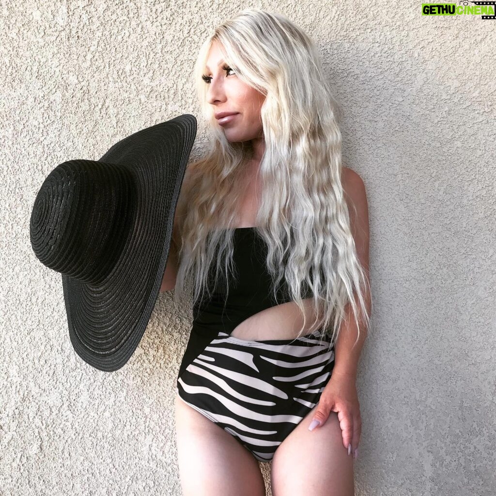 Jasmine Arteaga Sorge Instagram - Summer means…bathing suits, hats and mermaid hair. Love how I don’t have to worry about my hair in the water 💦 I can swim and still feel confident it will stay on ☀️💦💦#summer #onepiece #thinninghair #littlepeople #mermaid #allsizesmatter