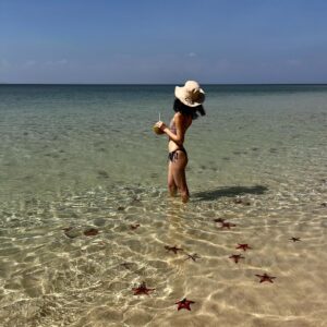 Jeannie Elise Mai Instagram - 📍Starfish beach 🇻🇳🏝️🌞🍹 ps if u look closely under my left cheek, u will spot my newest tattoo 😜 can anyone guess what it says lmao