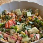 Jen Gunter Instagram – Crunchy corn salad.

This is one of my favorite crunchy big salad lunches that comes together in less than 15 minutes and is so worth it. Now that corn is in season I am making it a lot. This is for one. What can I say, I like a big salad! 

Microwave one ear of corn (I peel almost all of it and leave 1-2 layers on) for 2 minutes on high

Dressing: mix this all in the bowl you will use for the salad:

2 tsp tahini 
1 tbsp plain Greek yogurt (full fat, no fat whatever) 
Juice 1/2 lime
1 tbsp water
Sriracha to taste 

Chop and add to the dressing:

1 cucumber peeled (or unpeeled if it’s the kind that doesn’t need it)
1 red pepper 
1 cup cilantro including stems
1 jalapeño
Corn kernels
1/4 cup crumbled feta 

Mix and enjoy

I always think a salad like this is going to have a bazillion grams of fiber, so I decided to count and it looks like it’s about 11 or 12 g. 

When I want a super mega fiber rich lunch, I make this into a wrap with these carb cutting La Tortilla tortillas (swipe to see). We bought them once because there were essentially no other choices at the store for some strange reason, and when I realized they have 14 g of fiber per serving I was sold. They are one of those good staples to have in the house to quickly bump up the fiber in your day. Sometimes you need those products that just get the job done 😂