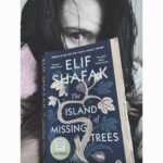 Jennie Jacques Instagram - 1970’s Cyprus, the war-torn but beautiful Mediterranean island, is tangled up in the roots of this story. Conflict, trauma & danger keep the characters feet planted firmly on the blood-soaked soil - yet fleeing for some may be inevitable. What a time & place to fall in love. A Greek boy, Kostas (who has a profound fondness for trees, nature & animals) & his Turkish lover Defne (in their teens!) are head over heels for each other - quashing family feud, challenging tradition & religion, they meet up in secret at The Happy Fig tavern; with a real life Fig Tree growing indoors, at the heart of the venue, listening to every drunken laugh & tale… run by the generous (& welcoming) gay couple (Yiorgos & Yusuf) & occupied by a cheeky parrot they have rescued 🦜 ♥️ Kostas’s mother eventually gets suspicious (of course) & sends him away to an Uncle in London, rather abruptly. She’s already lost 2 of her 3 young sons, the decision is to (ultimately) keep Kostas safe. But poor Defne is left behind 🤰- the writer tells it all so much better than I can summarise - please read! #theislandofmissingtrees is set in the 1974 Cyprus & told by British Turkish author #elifshafak with some significant bouncing between London & the early 2000’s, which gives it an added dimension/contemporary twist. Regrettably the universal language here is grief. But tremendous loss often leads to rebirth & growth… Can pain be inherited? How much does the past of a family shape their children’s future? Even if the kids did not live through it? With out spoiling, I can confirm the star-crossed lovers end up back together. Moreover, plenty more unfolds; through Ada, their daughter, an aunt & the soul of the aforementioned Fig Tree. YES, there’s a talking tree. And honestly, it’s just incredible. Good humour, superstition & a real love for food & family, enrich the story & dilute some of the sadness. The chapters give perspective through different characters & there’s a gorgeous “coming of age” element adding unexpected warmth. This novel intertwines immigration, teenage angst, identity, homophobia, belonging, scars & the dichotomy & lack of consistency in “human kindness.” 5/5 ⭐️